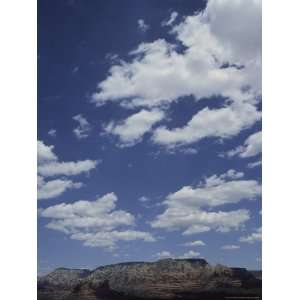 Cloud Filled Sky Rises Above the Red Rocks of Sedona Photographic 