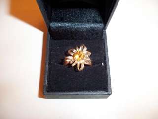 The 4 prong set solitaire citrine stone is approximately 7 mm.