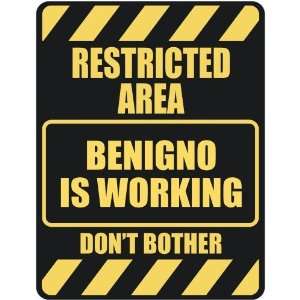   RESTRICTED AREA BENIGNO IS WORKING  PARKING SIGN