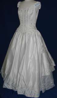   gown the color is white pearl beading basque waistline the dress is