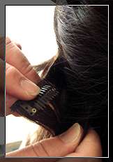 Clip the hair pieces on the hair layer by layer. Use each upper hair 