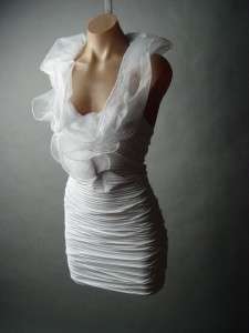  white fitted dress has such fabulous drama with its statement making 