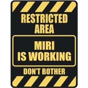   RESTRICTED AREA MIRI IS WORKING  PARKING SIGN