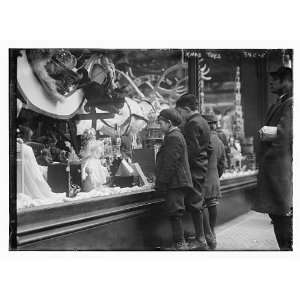    Children looking at Xmas toys in shop window