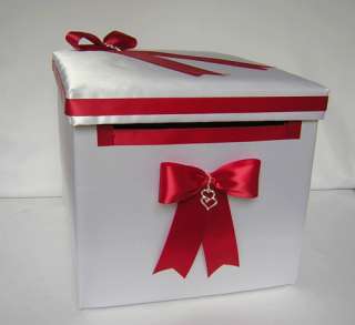   ARE DECORATED WITH APPLE RED SATIN BOWS AND DOUBLE HEART CHARMS
