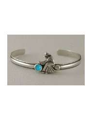   on a Sterling Silver Cuff Bracelet Accented with Genuine Turquoise