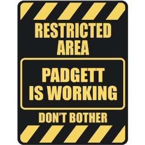  RESTRICTED AREA PADGETT IS WORKING  PARKING SIGN