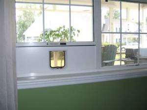 LARGE ELECTROMAGNETIC WINDOW MOUNTED CAT or DOG DOOR.  