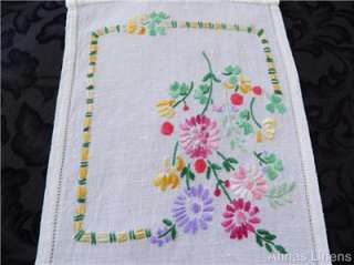   on a white linen/rayon fabric. Offered in excellent condition