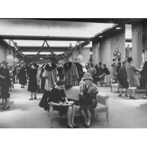  Shoppers in the Womens Coat Dept. of Saks Fifth Ave 