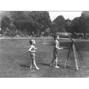  Two Boys with a Water Hose in a Devon Garden Stretched 